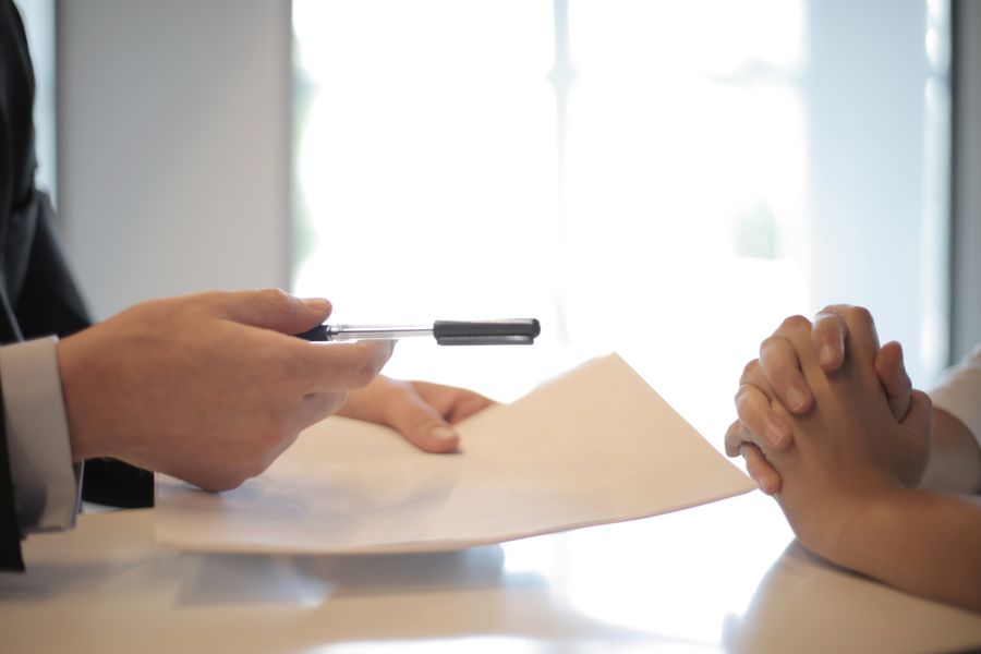 People reviewing paperwork together at a desk